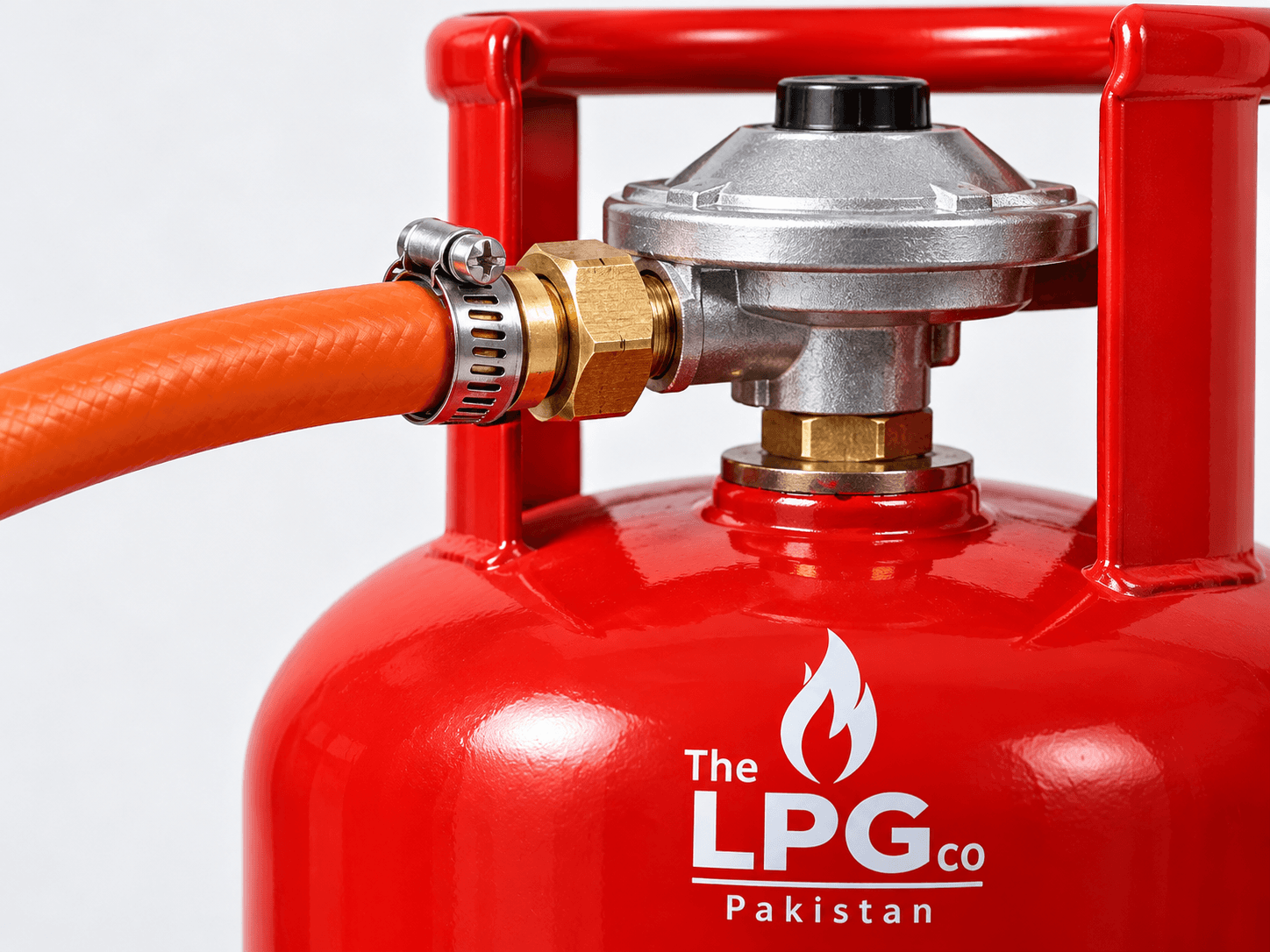 LPG regulator close-up with orange hose clamp — LPG safety connection detail